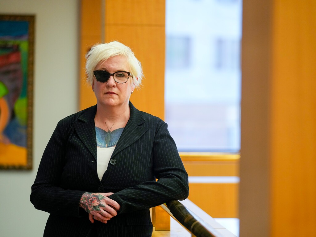 (Bethany Baker  |  The Salt Lake Tribune) Jennifer Andrus, a University of Utah professor and domestic violence expert, stands for a portrait at the University of Utah in Salt Lake City on Friday, Jan. 26, 2024. Andrus lost use of her right eye when her now ex-husband held her hostage and shot her multiple times. 