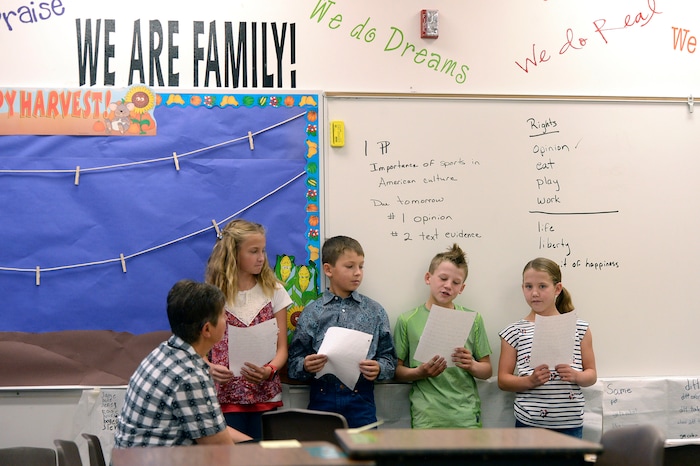 (Al Hartmann | The Salt Lake Tribune) Teachers aid Holly Carter with second and third graders at Park Valley School Wednesday August 30. Switching to a four-day school week made for long days but it left Fridays open for students to help on their family farms and ranches.
