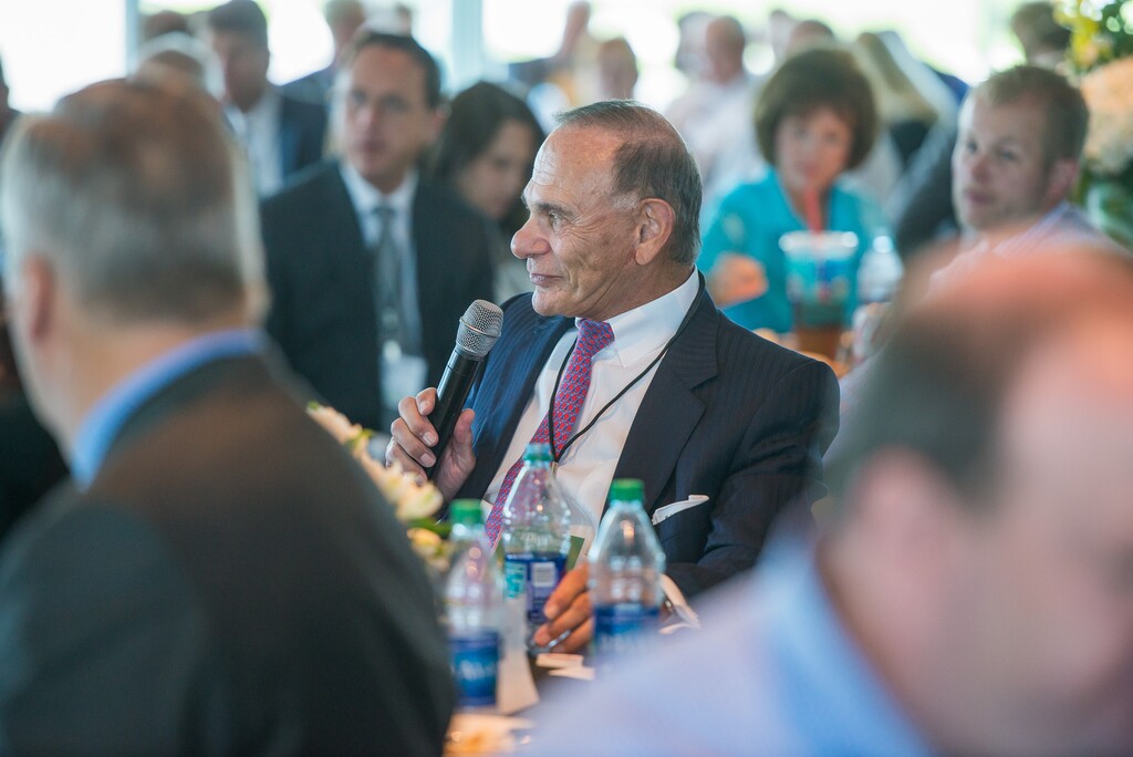 Courtesy photo  Edward St. John, founder of St. John Properties, speaks Tuesday at a ceremony celebrating his company's Valley Grove development in Pleasant Grove in Utah County.