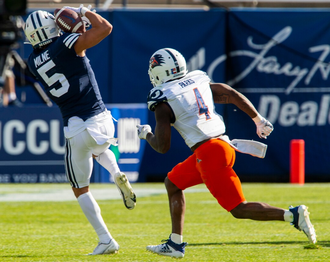 (Rick Egan  |  The Salt Lake Tribune)   Brigham Young Cougars wide receiver Dax Milne (5) snags a pass, as UTSA Roadrunners safety Antonio Parks (4) defends, in football action between the Brigham Young Cougars and the UTSA Roadrunners, at Lavell Edwards stadium, Saturday, Oct. 10, 2020.