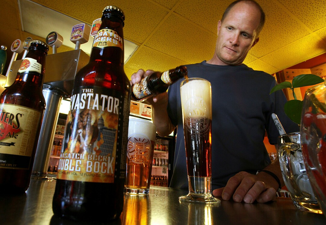(Scott Sommerdorf | Tribune file photo) Brewmaster Dan Burick pours and samples the IPA (left) and the Devastator beers during a taste test quality assurance testing, Thursday, July 31, 2008.