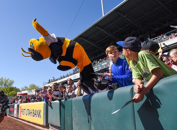 (Francisco Kjolseth  |  The Salt Lake Tribune)  Bumble fulfills a request for a back flip by the young fans in attendance of the Bee's game against the Rainiers during the annual staging of the kids day game on Thursday, May 2, 2019.