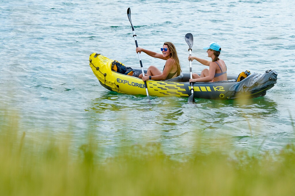 (Francisco Kjolseth  |  The Salt Lake Tribune)  They may not get to swim but Briana Saenger, left, and Emily Glasscock still enjoy the emerald green water at Little Dell Reservoir, a protected watershed, on Thursday.