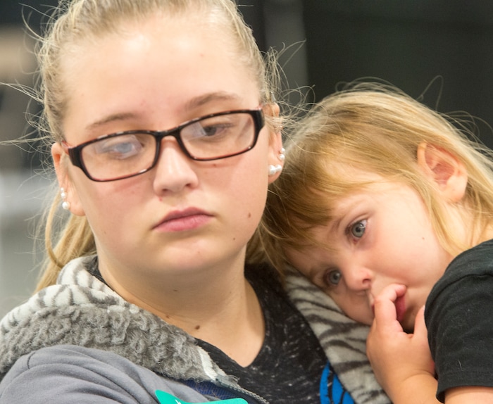 (Rick Egan  |  The Salt Lake Tribune)  Hailey Bartlett and her 3-year-old daughter, Abigail Fletcher, talk to legal help advisers during Project Homeless Connect on Friday, October 6, 2017.