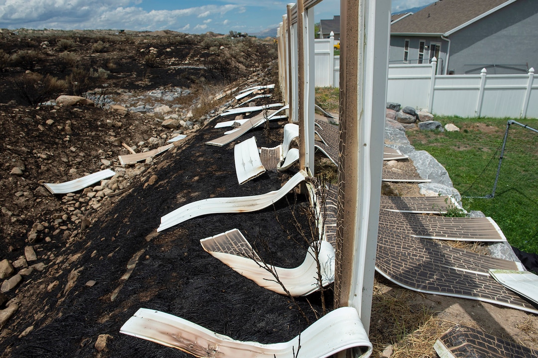 (Rick Egan  |  The Salt Lake Tribune)      The Knolls fire melted fences and did some property damage, but spared the homes on Sunrise Drive in Sunday's fire, in Saratoga Springs, Monday, June 29, 2020.