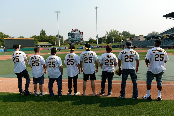 (Francisco Kjolseth  |  The Salt Lake Tribune)  The Salt Lake Bees celebrate the 25th anniversary of the Utah-filmed "The Sandlot" with members of the original cast at the Smith's Ballpark on Friday, Aug. 10, 2018. Bertram (Grant Gelt), Smalls (Tom Guiry), Tommy (Shane Obedzinski) Timmy (Victor DiMattia), Phillips (Wil Horneff) Ham (Patrick Renna), Yeah-Yeah (Marty York) and DeNunez (Brandon Quintin Adam), from left, gather on the field with their personalized Bees jerseys before the start of the night's game. 
