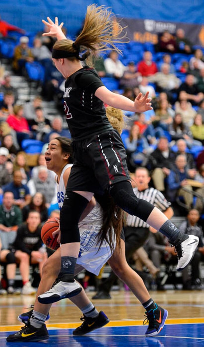 (Trent Nelson | The Salt Lake Tribune)  Northridge's Lydia Mashburn (22) fouls Bingham's Meleane Lokotui (23) as Bingham faces Northridge in the 6A High School Girls' Basketball Tournament at SLCC in Taylorsville, Thursday Feb. 22, 2018.