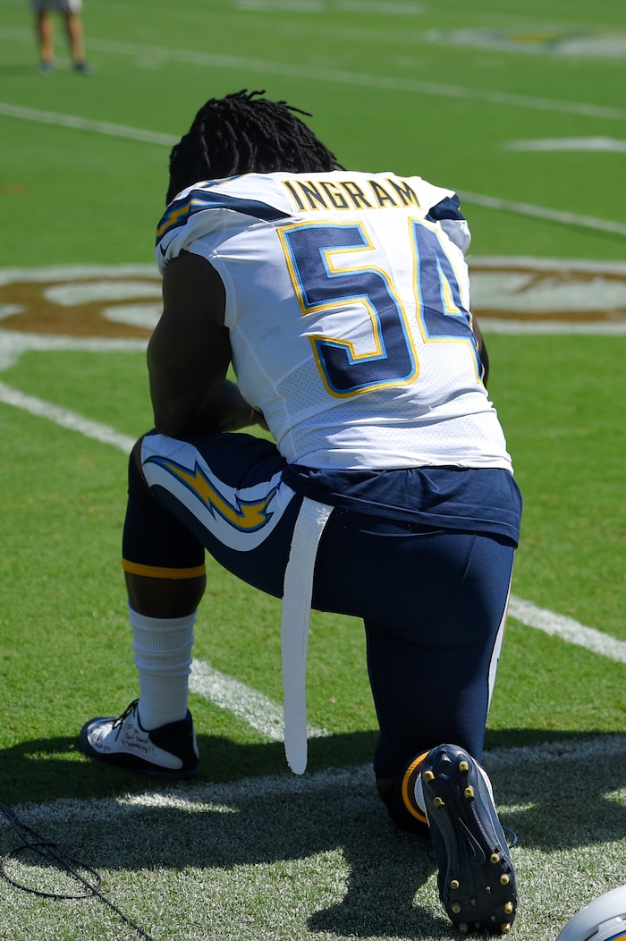 Los Angeles Chargers outside linebacker Melvin Ingram knees in protest during the National Anthem before an NFL football game against the against the Kansas City Chiefs Sunday, Sept. 24, 2017, in Carson, Calif. (AP Photo/Mark J. Terrill)