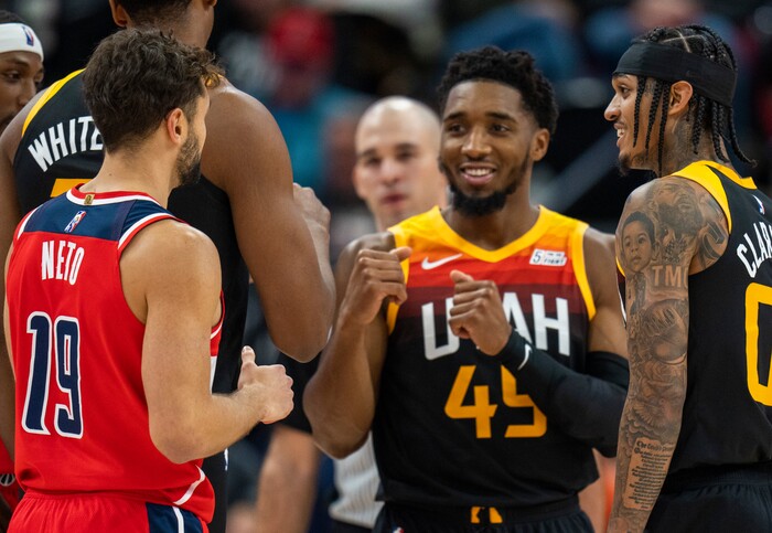 (Rick Egan | The Salt Lake Tribune) Utah Jazz guard Donovan Mitchell (45) and Utah Jazz guard Jordan Clarkson (00) joke with former Utah Jazz guard, Washington Wizards guard Raul Neto (19), in NBA action between the Utah Jazz and the Washington Wizards, at Vivint Arena on Saturday, Dec. 18, 2021.