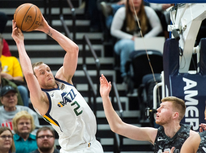 (Rick Egan  |  The Salt Lake Tribune)  Utah Jazz forward Joe Ingles (2) tosses a pass back to the top, as San Antonio Spurs forward Davis Bertans (42) defends, in NBA action Utah Jazz vs San Antonio Spurs in Salt Lake City, Monday, February 12, 2018.