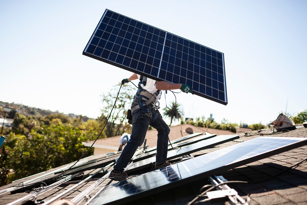 (Collin Chappelle | The New York Times)

A Sunrun installer carries a solar panel into place at a customer’s home in Carlsbad, Calif., Oct. 18, 2018.