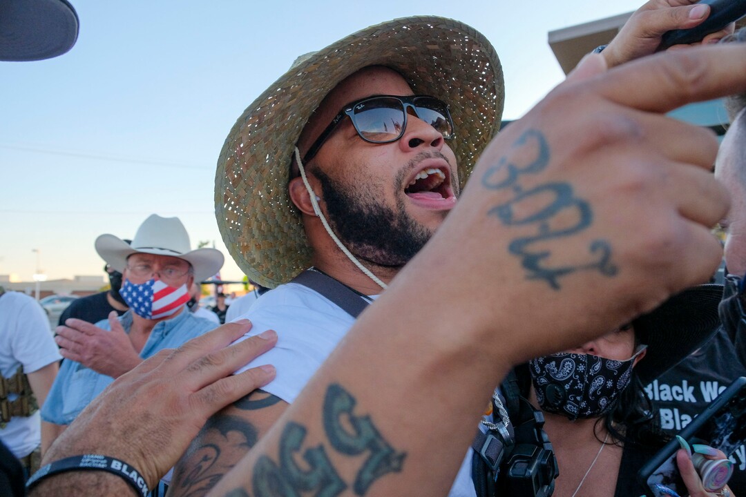 (Leah Hogsten  |  The Salt Lake Tribune) Kay Jay, a reporter with Salt City News exchanges words with supporters of Blue Lives Matter and CHPD. Kay Jay was pepper-sprayed later that evening. Five days after after nine protesters were arrested during a peaceful rally in memory of Zane James that turned into a violent clash with Cottonwood Heights officers, demonstrators gathered outside the police station Friday to denounce CHPD's actions and its officers for inciting the violence.