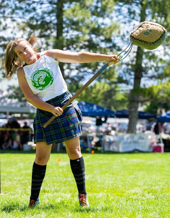 (Rick Egan | The Salt Lake Tribune) Chelsea Forsythe participates in the  Highland games Sheaf Toss competition, at the Payson Scottish Festival, on Saturday, July 9, 2022.
