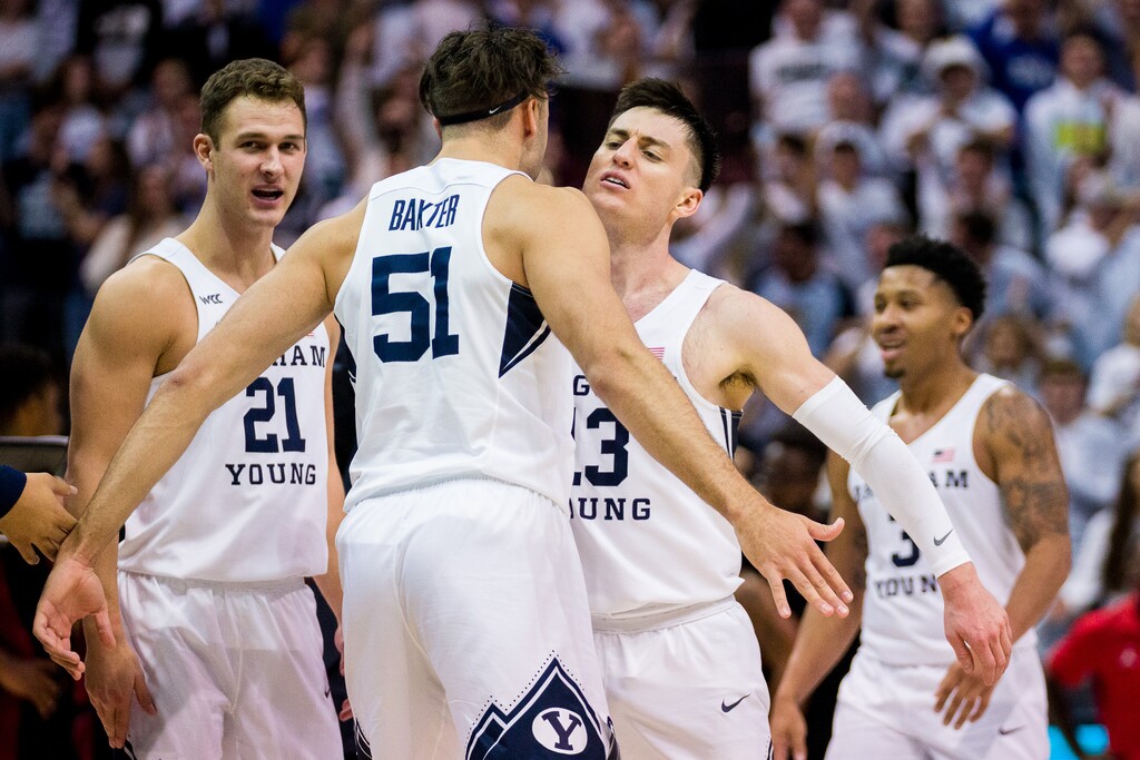 (Trent Nelson | The Salt Lake Tribune) Brigham Young Cougars forward Gavin Baxter (51) and Brigham Young Cougars guard Alex Barcello (13) celebrates a lead in the final minute as BYU hosts San Diego State, NCAA basketball in Provo on Friday, Nov. 12, 2021.