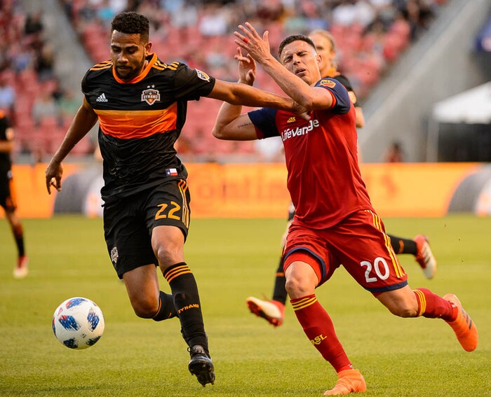 (Trent Nelson | The Salt Lake Tribune)  
Real Salt Lake midfielder Luis Silva (20) takes a hand to the face from Houston Dynamo defender Leonardo (22) as Real Salt Lake hosts Houston Dynamo, MLS Soccer at Rio Tinto Stadium in Sandy, Utah, Wednesday May 30, 2018.