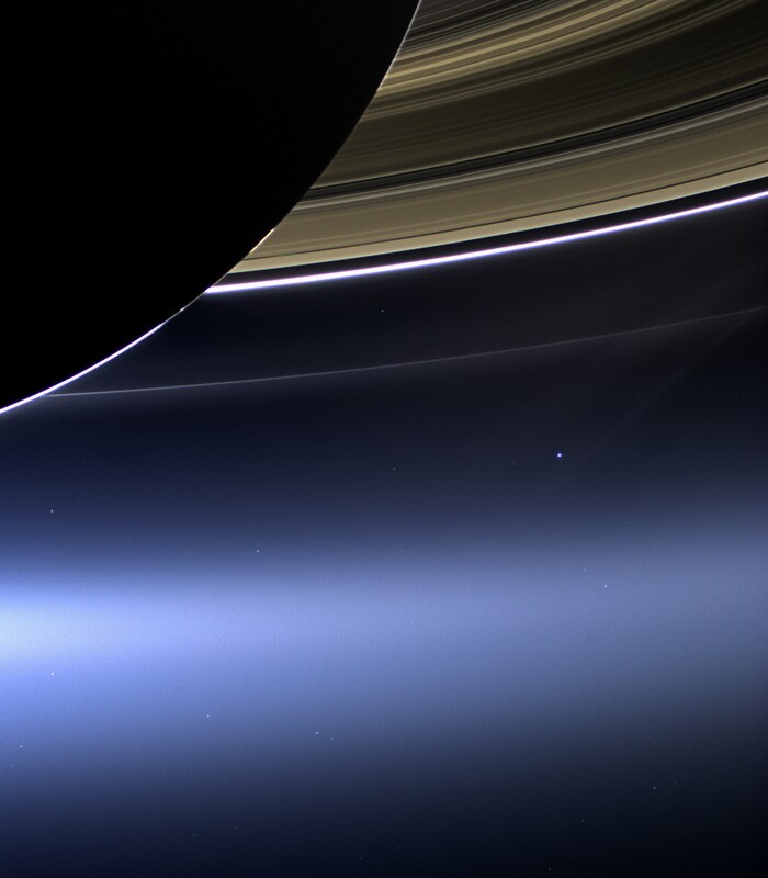 This July 19, 2013 image made available by NASA shows Saturn's rings and planet Earth, center right, as seen from the Cassini spacecraft. (NASA/JPL-Caltech/Space Science Institute via AP)