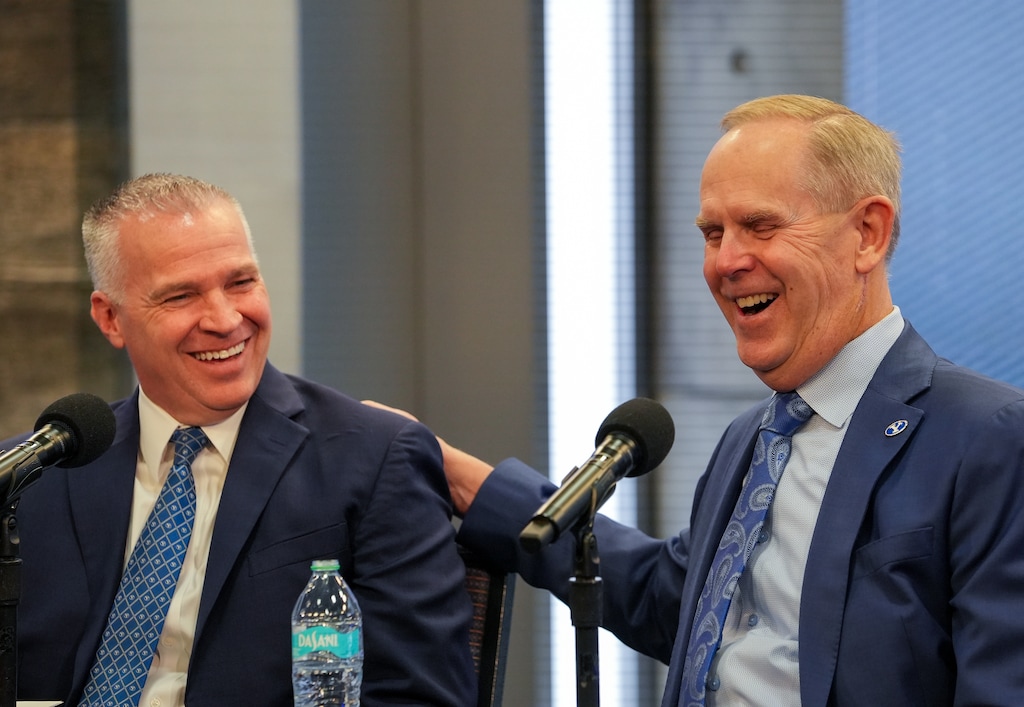 (Chris Samuels | The Salt Lake Tribune) BYU President Shane Reese and athletics director Tom Holmoe interact during a news conference in Provo, Wednesday, Feb. 12, 2025, announcing Holmoe’s retirement after 20 years at the school.