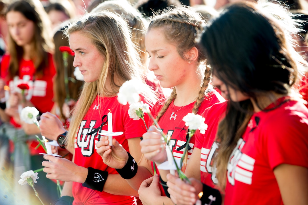 (Jeremy Harmon  |  The Salt Lake Tribune) Members of the University of Utah track team gather during a vigil for teammate Lauren McCluskey on Wed. Oct 24, 2018. McCluskey was killed on campus on Monday.