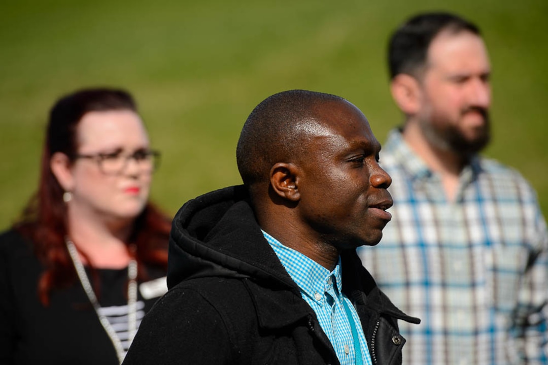 (Trent Nelson | The Salt Lake Tribune)  Leonard Bagalwa talks about Utah's "bridge" Medicaid expansion program at a news conference in Salt Lake City's Liberty Park on Monday April 1, 2019. At rear are Stacy Sanford and Nate Crippes.