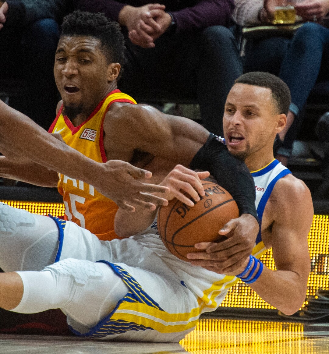 (Rick Egan  |  The Salt Lake Tribune)  Utah Utah Jazz guard Donovan Mitchell (45) goes for a loose ball along with Golden State Warriors guard Stephen Curry (30), in NBA action between Utah Jazz and Golden State Warriors, in Salt Lake City, Wednesday, Dec. 19, 2018.