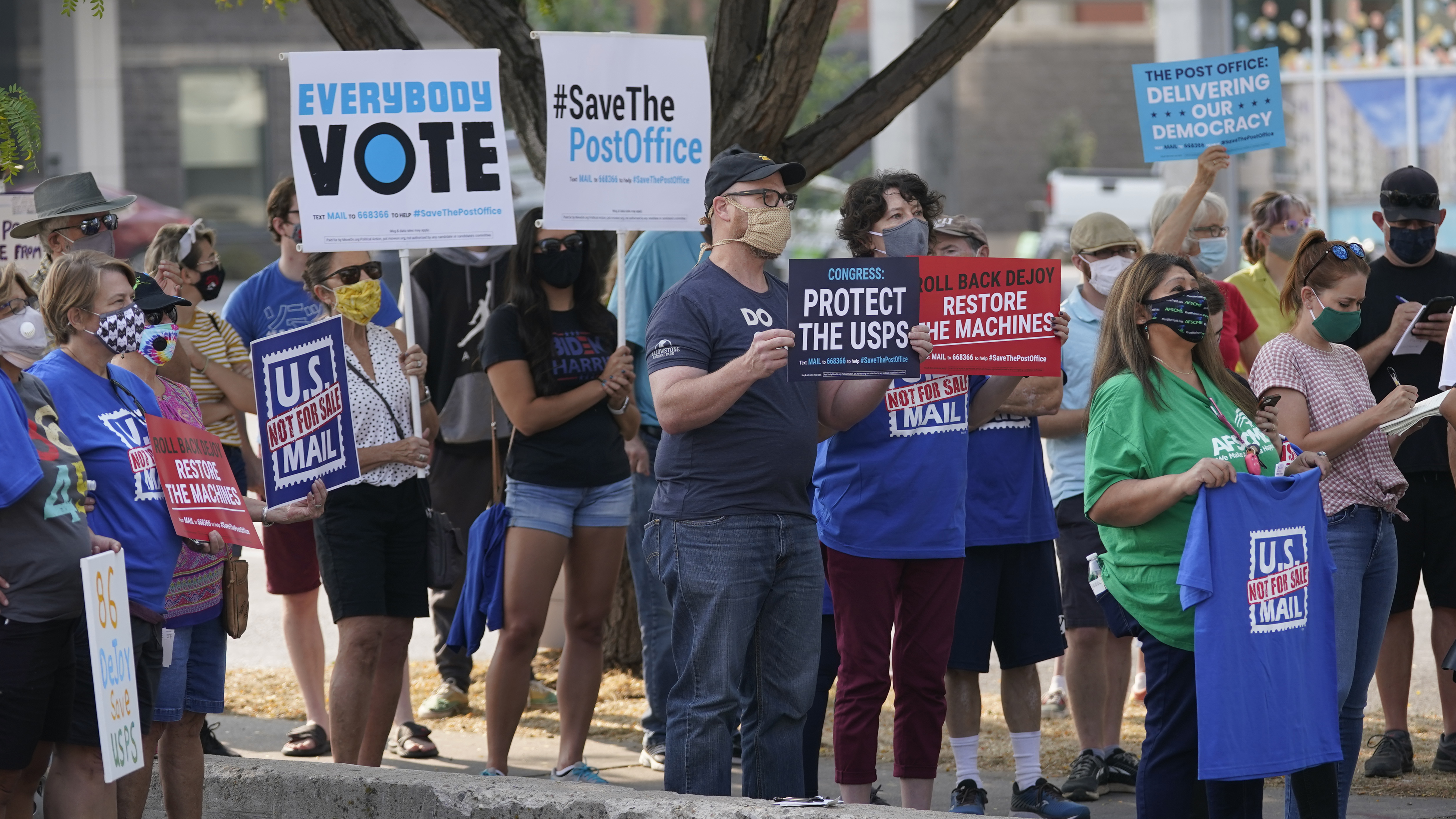 (Rick Bowmer | AP photo)

People gather during the "Save the Post Office" rally Saturday, Aug. 22, 2020, in Salt Lake City. Postmaster General Louis DeJoy is declaring it's his "sacred duty" to ensure election mail delivery this fall.