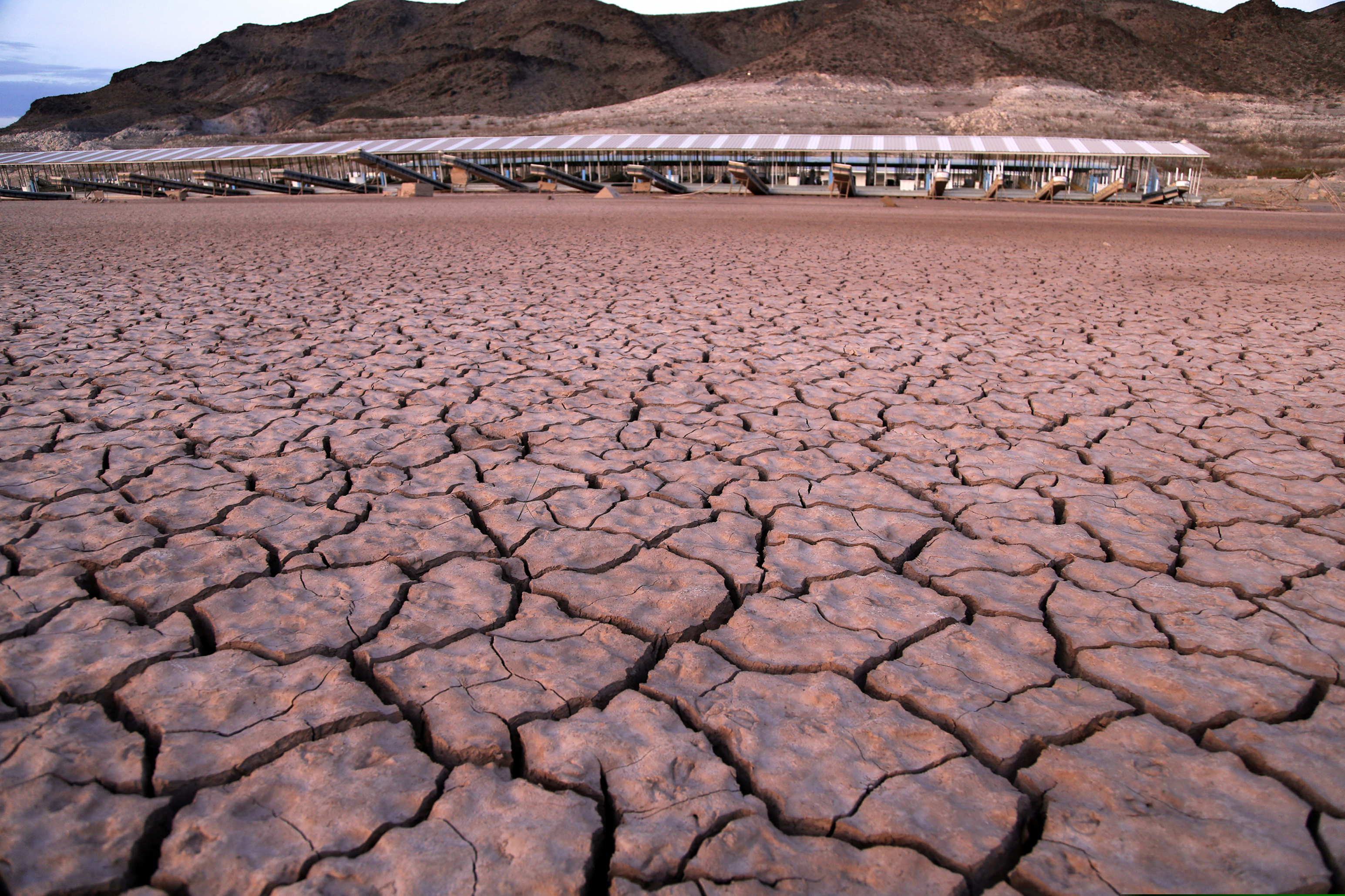 (John Locher | The Associated Press) In this July 16, 2014 file photo, what was once a marina sits high and dry due to Lake Mead receding in the Lake Mead National Recreation Area in Arizona. Arizona is nearing a deadline to approve a plan to ensure a key reservoir in the West doesn't become unusable as a water source for farmers, cities, tribes and developers. Other Western states are watching. The U.S. Bureau of Reclamation expects full agreement on a drought contingency plan by Thursday, Jan. 31, 2019.
