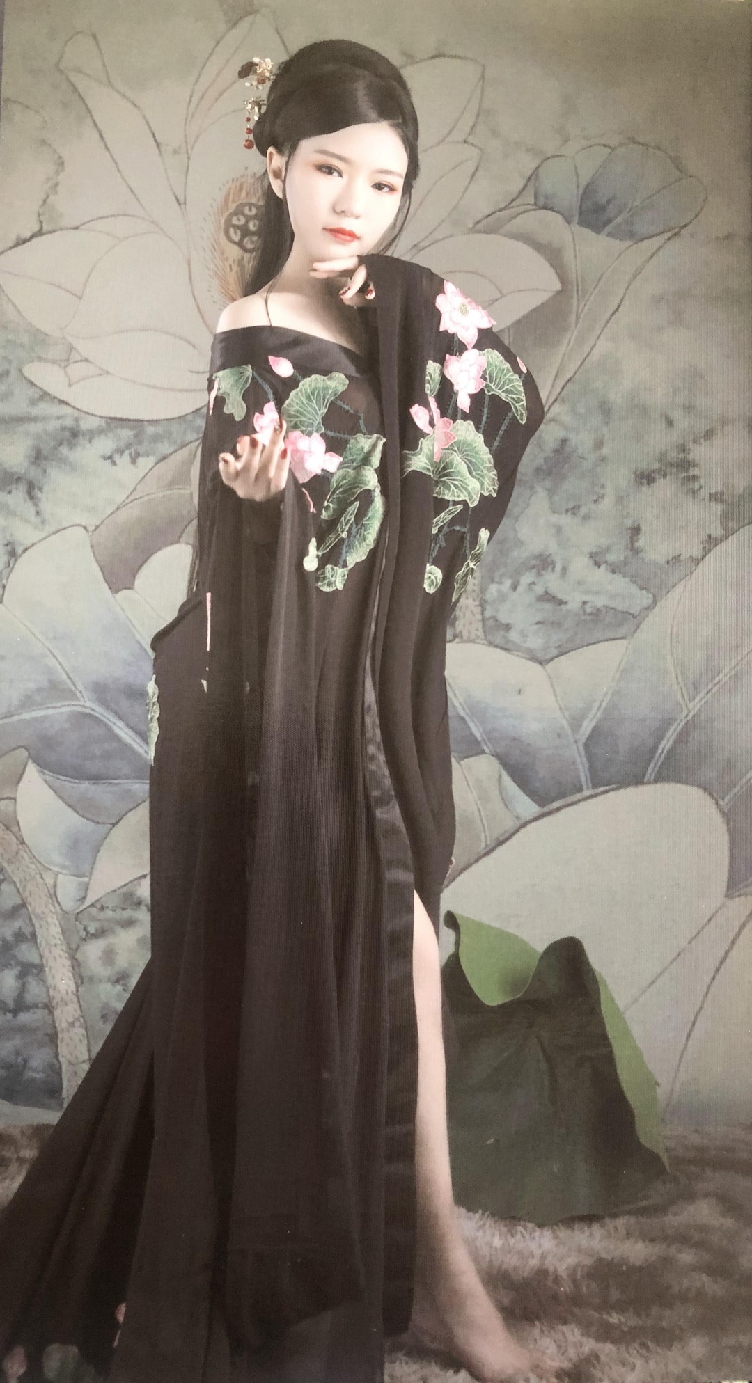 (Dong family) Pictured is Zhifan Dong in this undated photo, posing in traditional Chinese regalia.