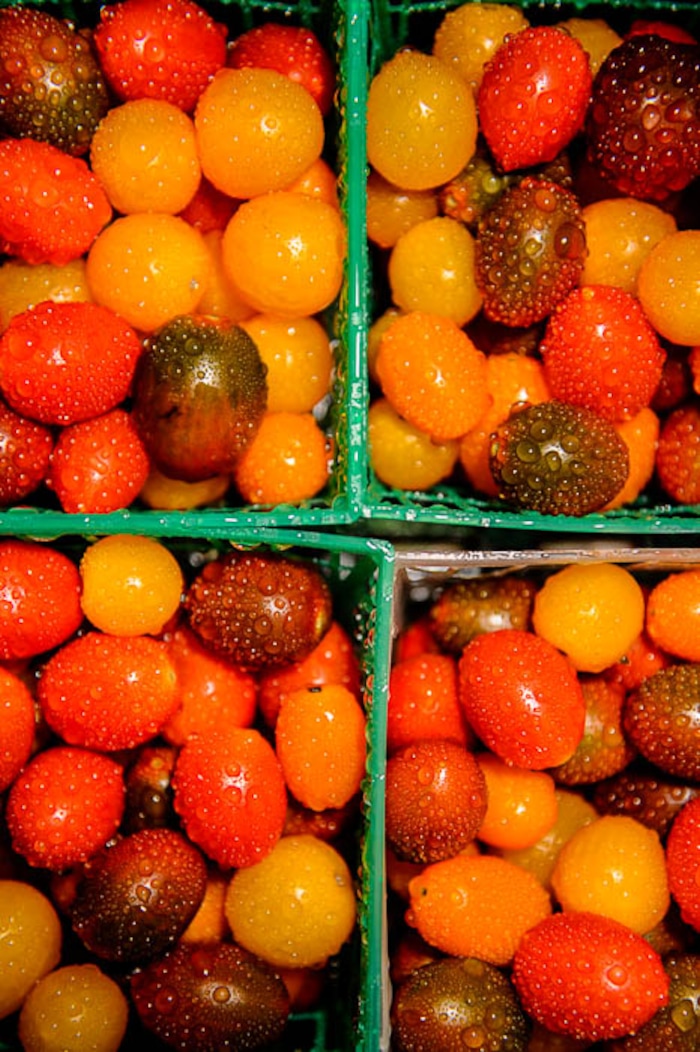 (Trent Nelson | The Salt Lake Tribune)  Cherry and grape heirloom tomatoes from Asian & Heirlooms at the Tuesday Farmer's Market in Salt Lake City's Pioneer Park, Tuesday Aug. 14, 2018. The laid-back market continues now through September and features about 20 vendors.