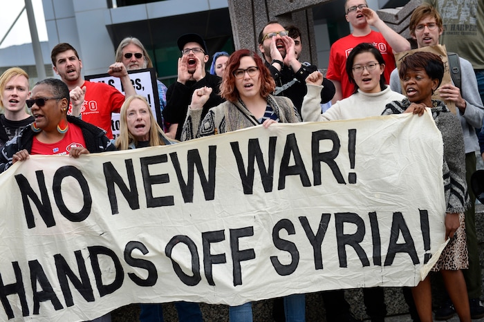 (Scott Sommerdorf | The Salt Lake Tribune)
A group of about 40 people protested the strikes on Syria, Sunday, April 15, 2018.