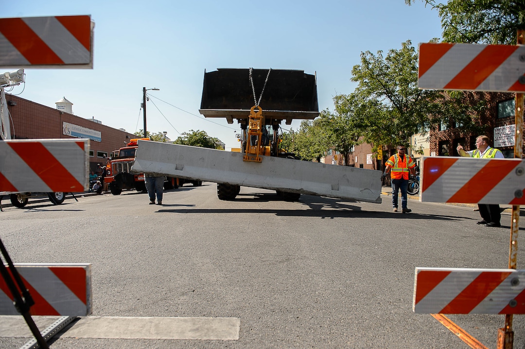 (Trent Nelson | The Salt Lake Tribune)  Workers install barriers on Rio Grande in Salt Lake City to prevent auto traffic in hopes of stopping the drug traffic around the area, Friday September 1, 2017.