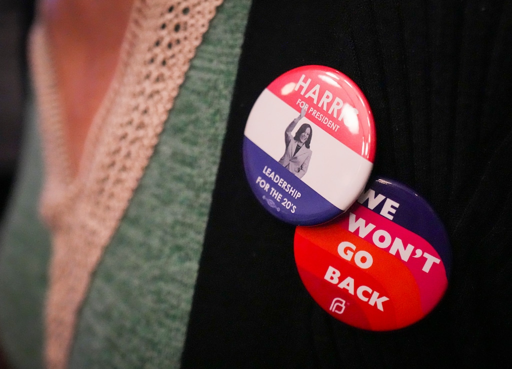 (Bethany Baker | The Salt Lake Tribune) A supporter of Vice President Kamala Harris, the Democratic presidential nominee, wears buttons in support of Harris at an election night watch party at Kimpton Hotel Monaco Salt Lake City in Salt Lake City on Tuesday, Nov. 5, 2024.