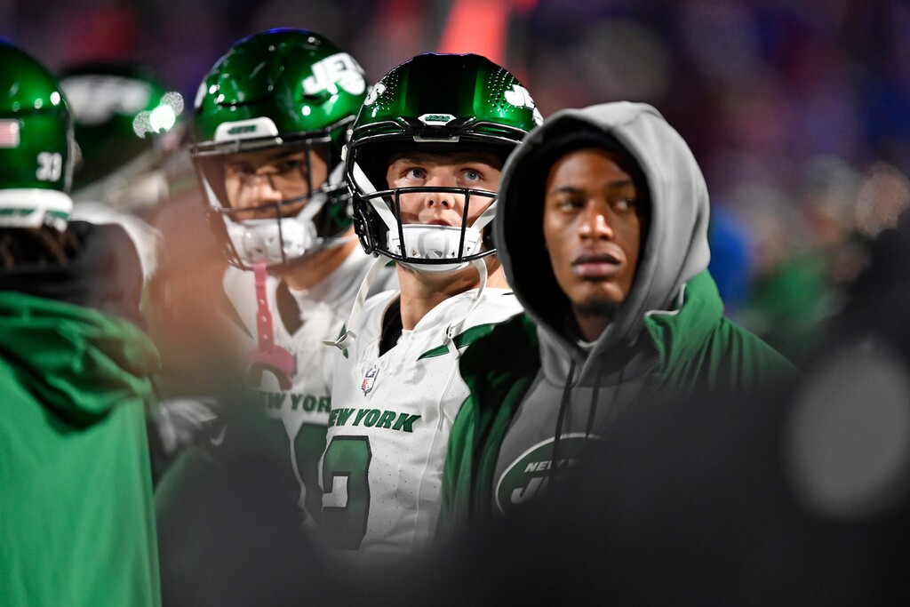 (Adrian Kraus | AP) New York Jets quarterback Zach Wilson, center, stands on the sidelines after being pulled from the NFL football game against the Buffalo Bills during the second half in Orchard Park, N.Y., Sunday.