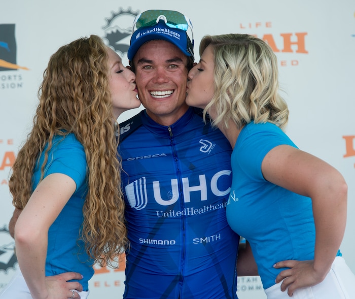 (Rick Egan  |  The Salt Lake Tribune)  Travis McCabe gets a kiss from the Nu Skin sponsor girls, after placing first in stage 5, in the Tour of Utah, in Bountiful,Friday, August 4, 2017.


