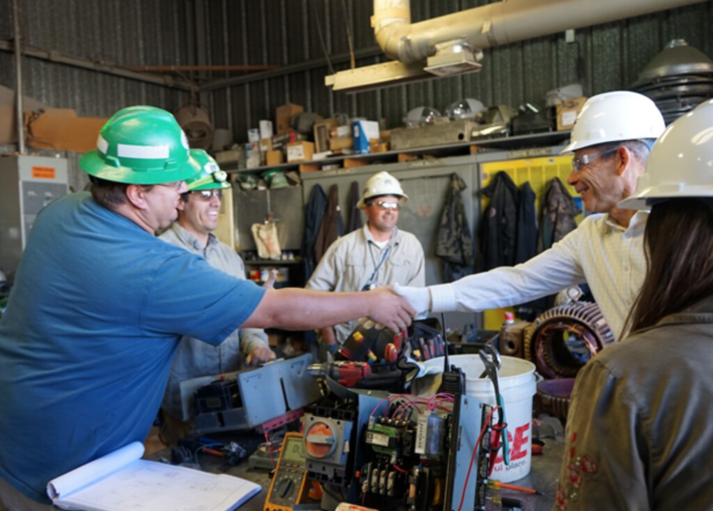 (Courtesy of Rep. John Curtis) Rep. John Curtis (right), R-Utah, shakes hands with an employee at Energy Fuels' White Mesa uranium mill in September 2019. Some $75 million for a reserve uranium was included in the massive spending bill passed by Congress this week.