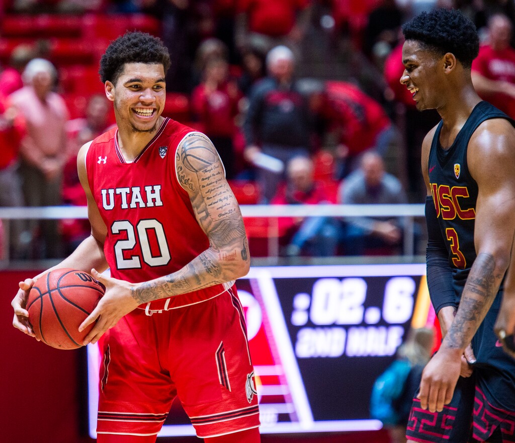 (Rick Egan  |  The Salt Lake Tribune)    USC Trojans guard Elijah Weaver (3), jokes with Utah Utes forward Timmy Allen (20) in the final seconds of the game, in PAC-12 basketball action between Utah Utes and USC Trojans at the Jon M. Huntsman Center, Thursday, March 7, 2019.