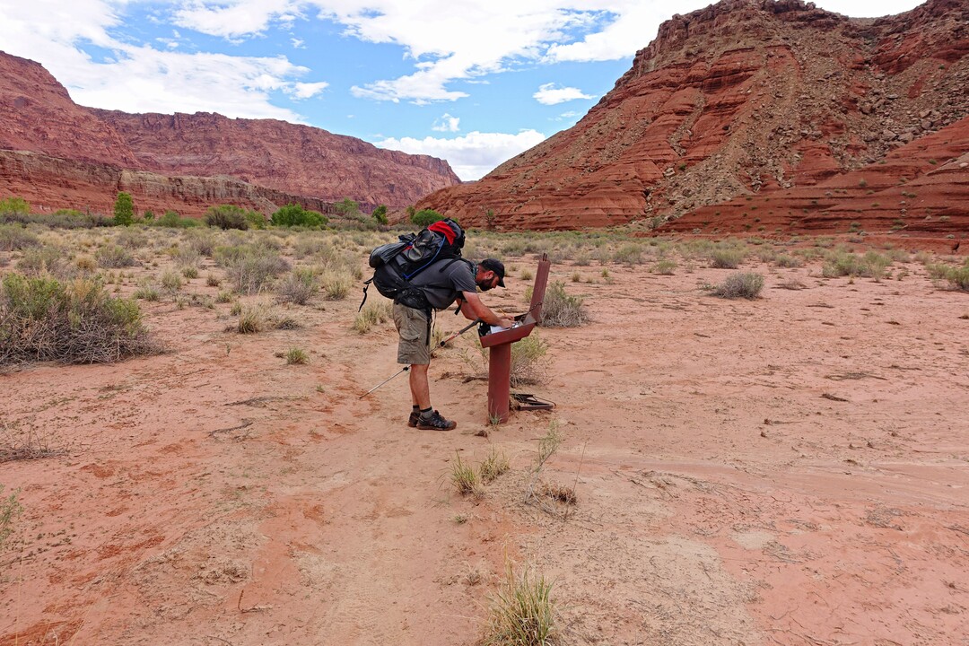 (Tribune File Photo)  Peter Wagner signs a log book after hiking nearly 50 miles through Paria Canyon. Wednesday, Sept. 28, 2016.