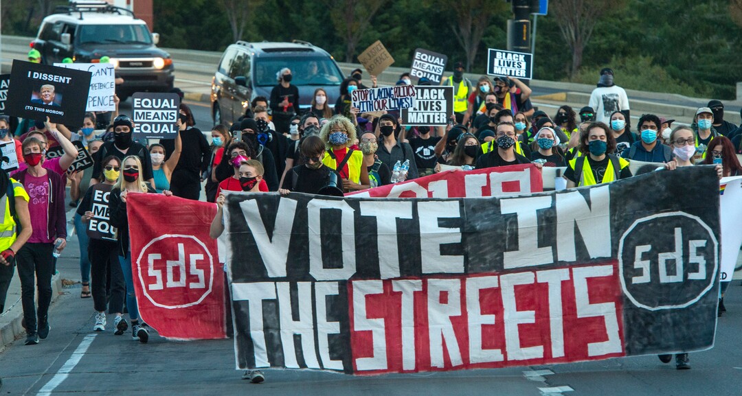 (Rick Egan  |  The Salt Lake Tribune) Protesters march toward the University of Utah where Mike Pence and Kamala Harris are participating in a Vice Presidential debate, on Wednesday, Oct. 7, 2020.