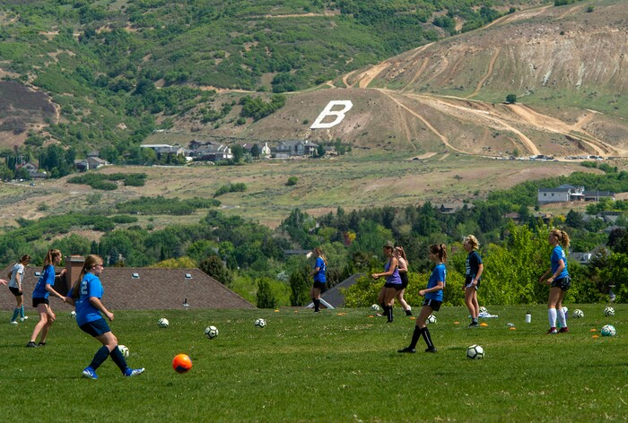 (Rick Egan  |  The Salt Lake Tribune)       A Surf soccer club team practices in Bountiful, Saturday, May 16, 2020.