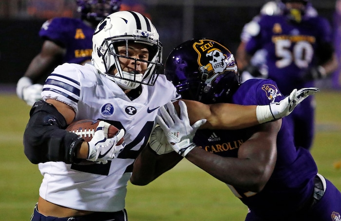 BYU's KJ Hall (24) collides with East Carolina's Davondre Robinson (13) during the second half of an NCAA college football game in Greenville, N.C., Saturday, Oct. 21, 2017. (AP Photo/Karl B DeBlaker)