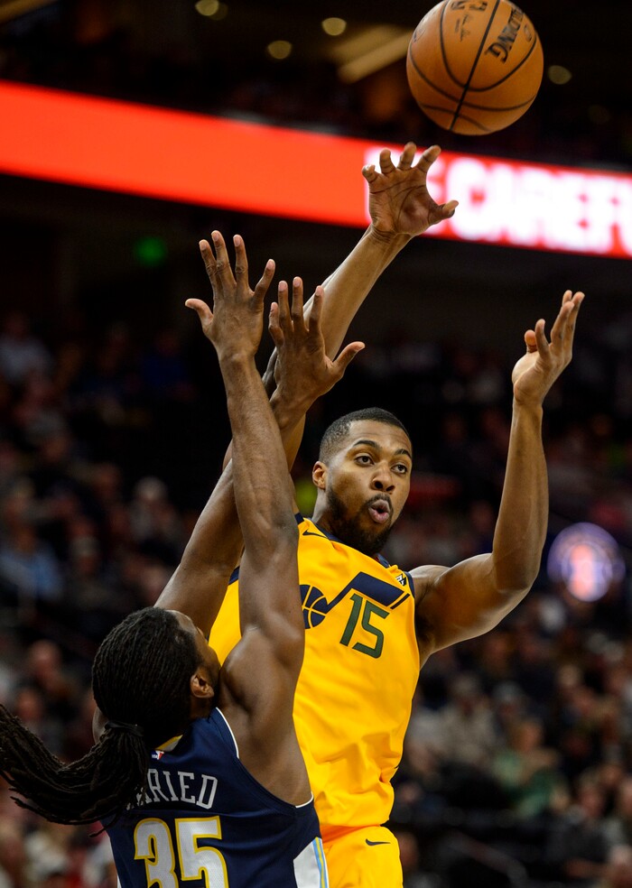 (Steve Griffin  |  The Salt Lake Tribune) Utah Jazz forward Derrick Favors (15) passes over Denver Nuggets forward Kenneth Faried (35) during the Utah Jazz versus Denver Nuggets NBA basketball game at Vivint Smart Home Arena  in Salt Lake City Tuesday November 28, 2017.
