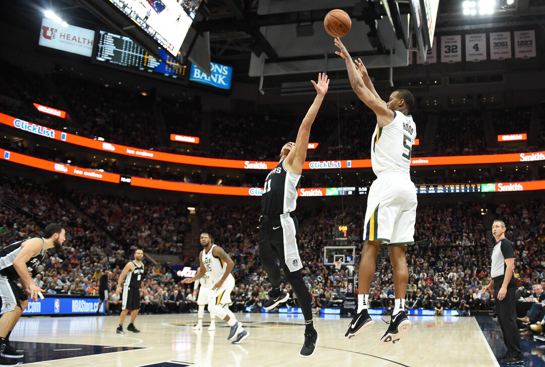 (Francisco Kjolseth  |  The Salt Lake Tribune)  Utah Jazz guard Rodney Hood (5) nails a three pointer over San Antonio Spurs guard Bryn Forbes (11) during the second half of the NBA basketball game in Salt Lake City, Thursday, Dec. 21, 2017.