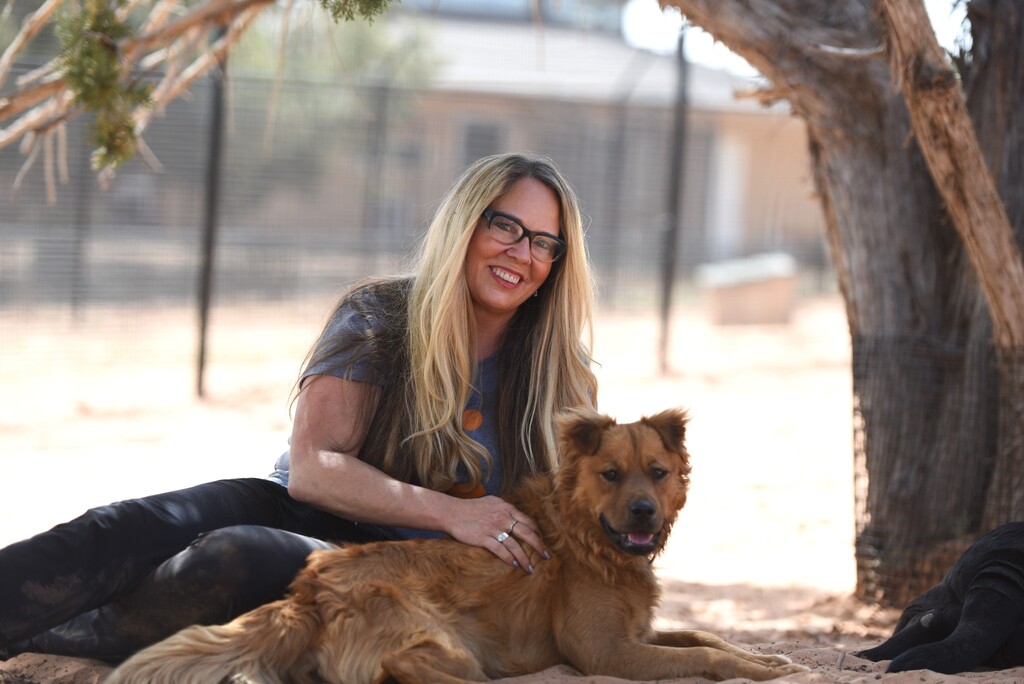 Julie Castle, CEO of Best Friends Animal Society, with Finnegan.
