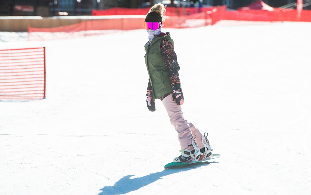 (Rick Egan | The Salt Lake Tribune) 
A snowboarder enjoys a few turns at Park City Mountain Resort on opening day, Friday, Nov. 20, 2020. Park City resort was schedule to open Nov. 19, 2021 but had to delay its start because temperatures have been too warm for snowmaking.