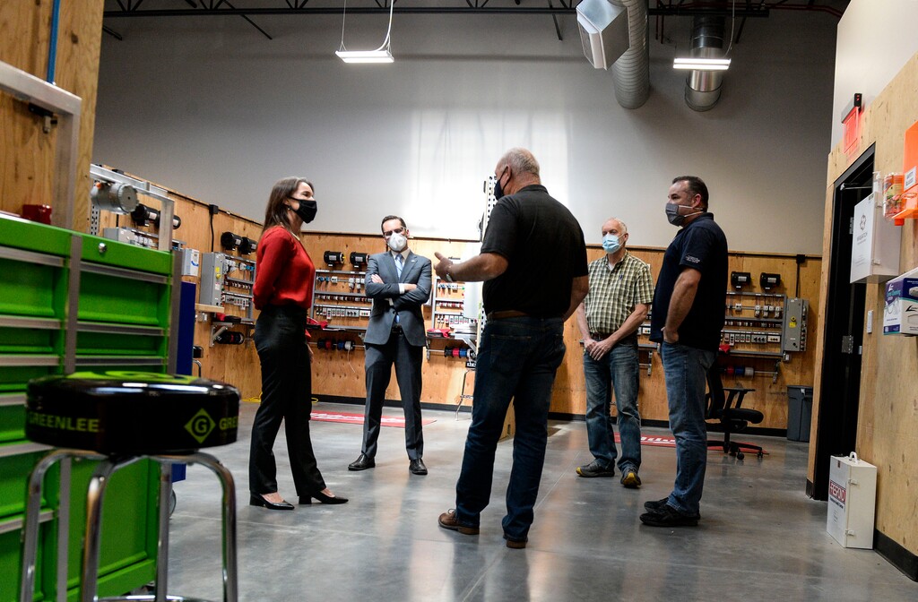 (Leah Hogsten  |  The Salt Lake Tribune) Chris Peterson, the Utah Democratic candidate for governor, and his running mate Karina Brown, left, tour the Utah Electrical Training Alliance in West Jordan with Steve Woodman, from the International Brotherhood of Electrical Workers (IBEW) #354; Carl Brailsford, director of the Electrical Training Alliance; and Mike Lanoue, assistant training director for the Alliance, on Oct. 16, 2020.