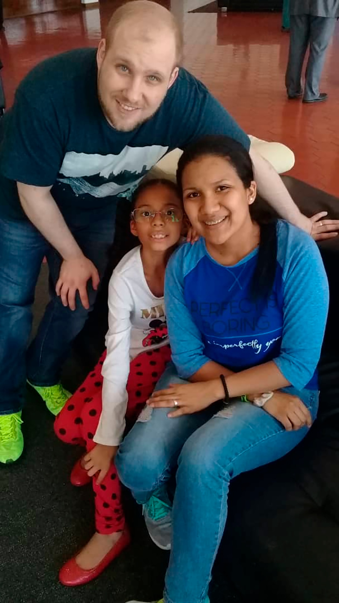 (Holt family photo via AP) In this image provided by the Holt family, Joshua Holt poses for a photo with his wife, Thamara, and her daughter, at the airport in Caracas, Venezuela, Saturday, May 26, 2018.  Jailed in Venezuela on weapons charges nearly two years ago, Holt was released Saturday after a U.S. senator pressed for his freedom in a surprise meeting with President Nicolas Maduro. Holt and his wife, who also jailed, were reunited with her daughter from a previous relationship at Caracas’ airport where the three boarded a chartered flight to Washington.
