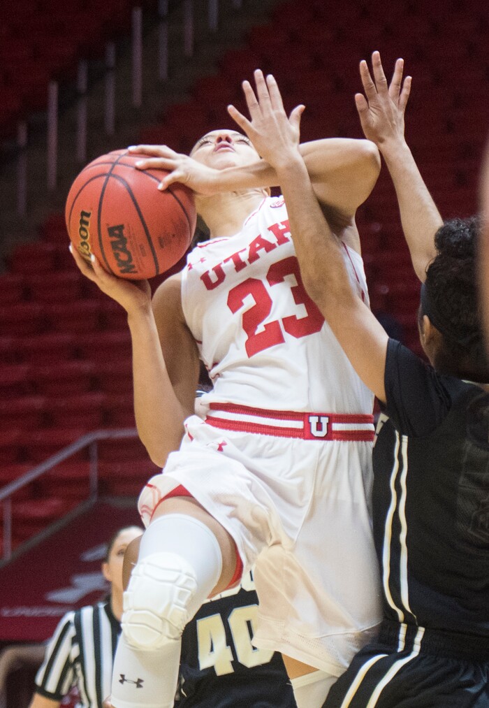 (Rick Egan  |  The Salt Lake Tribune)  Utah Utes guard/forward Daneesha Provo (23) goes up for a shot over Purdue Boilermakers guard Tiara Murphy (3), in basketball action Utah Utes vs. Purdue Boilermakers, at the Jon M. Huntsman Center, Monday, Nov. 20, 2017.
