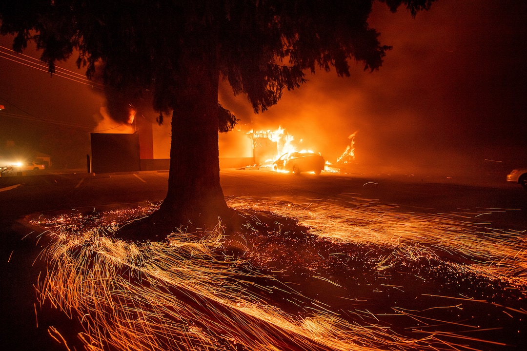 (Noah Berger | The Associated Press) Flames consume a Kentucky Fried Chicken as the Camp Fire tears through Paradise, Calif., on Thursday, Nov. 8, 2018. Tens of thousands of people fled a fast-moving wildfire Thursday in Northern California, some clutching babies and pets as they abandoned vehicles and struck out on foot ahead of the flames that forced the evacuation of an entire town and destroyed hundreds of structures.