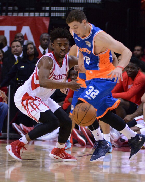 The Shanghai Sharks Jimmer Fredette (32) battles for the ball against the Houston Rockets Isaiah Taylor (17) in the second half of an NBA basketball exhibition game Sunday, Oct. 2, 2016, in Houston. (AP Photo/George Bridges)