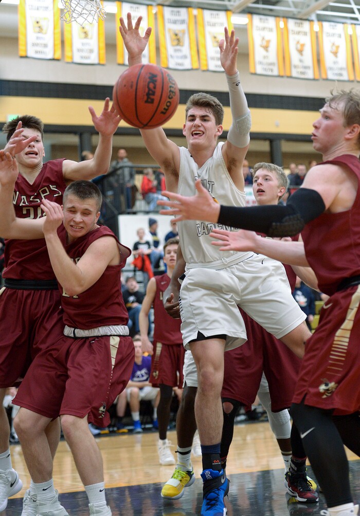 (Leah Hogsten  |  The Salt Lake Tribune) Summit's Tyler Kartchner fails to pull in the rebound grabbed by Juab's Alex White. Juab High School boys' basketball team defeated Summit Academy 61-58 in overtime during their 3A State tournament game in Heber  Saturday, Feb. 16, 2018.