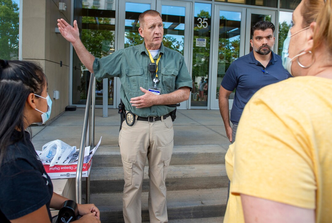(Rick Egan  |  The Salt Lake Tribune)    After taking down all of the signs from the past two days, Jim Winder tells the protesters that they are not allowed to put up signs on the District Attorney's office anymore, during a Justice for Bernardo protest on Wednesday, June 24, 2020.